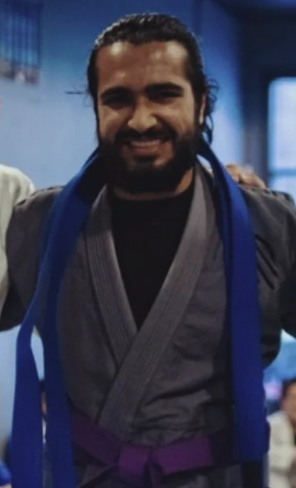 Nadir Tareen earning his purple belt in Brazilian Jiu-Jitsu.